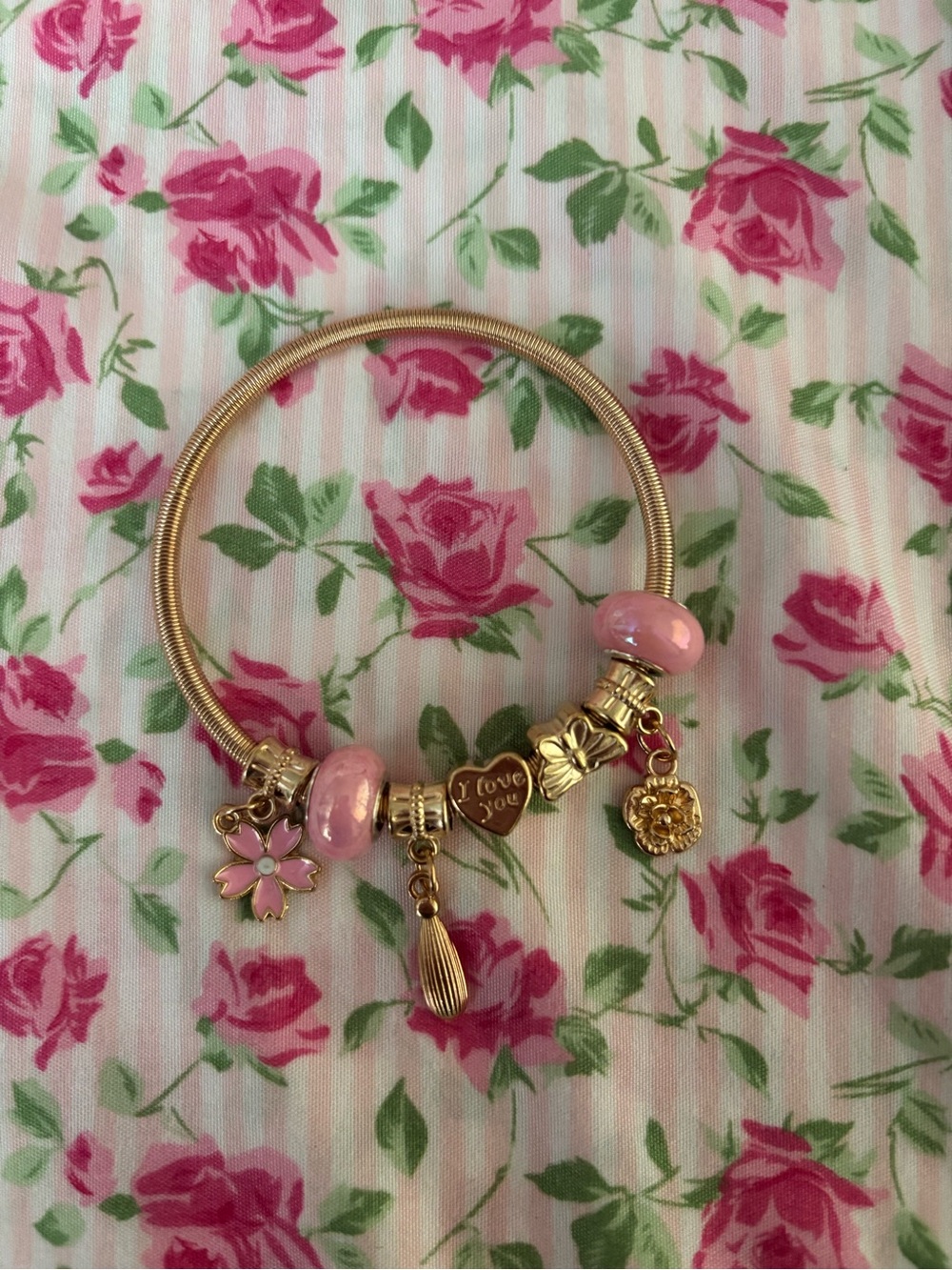 Gold-Tone Pink Charm Bracelet with Floral and Heart Pendants